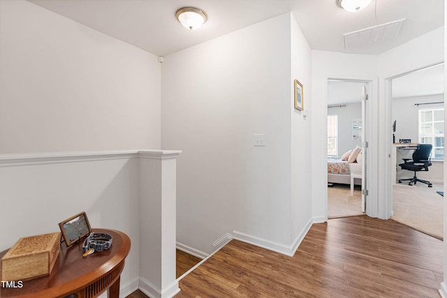 corridor featuring hardwood / wood-style floors