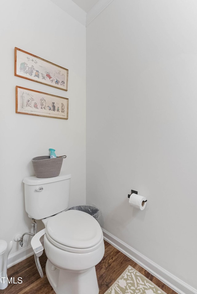 bathroom featuring wood-type flooring and toilet