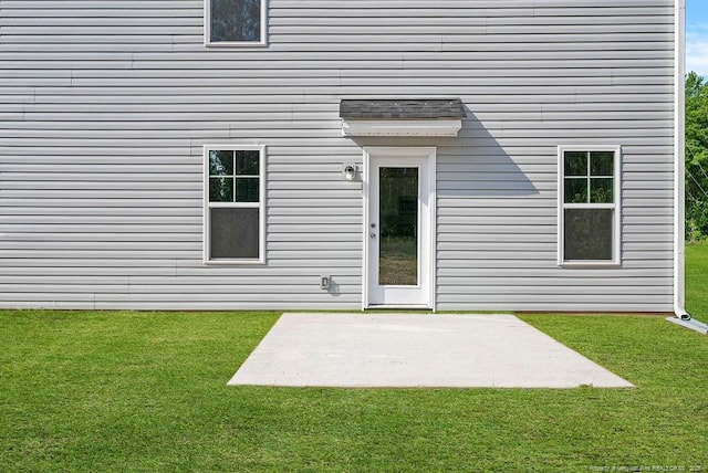 1114 Talmage Rd, Saint Pauls, NC 28384 - back of property featuring a patio area and a lawn