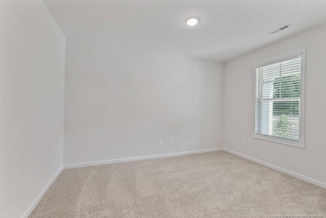 1114 Talmage Rd, Saint Pauls, NC 28384 - spare room featuring baseboards and carpet flooring