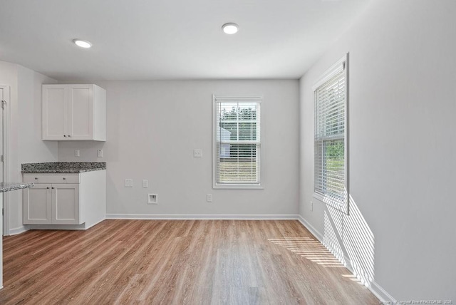 1114 Talmage Rd, Saint Pauls, NC 28384 - unfurnished dining area featuring light wood-style flooring, baseboards, and recessed lighting