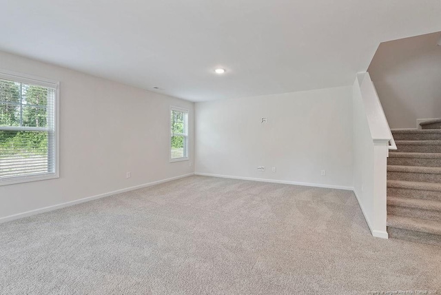 1114 Talmage Rd, Saint Pauls, NC 28384 - unfurnished room with plenty of natural light, light colored carpet, stairs, and recessed lighting