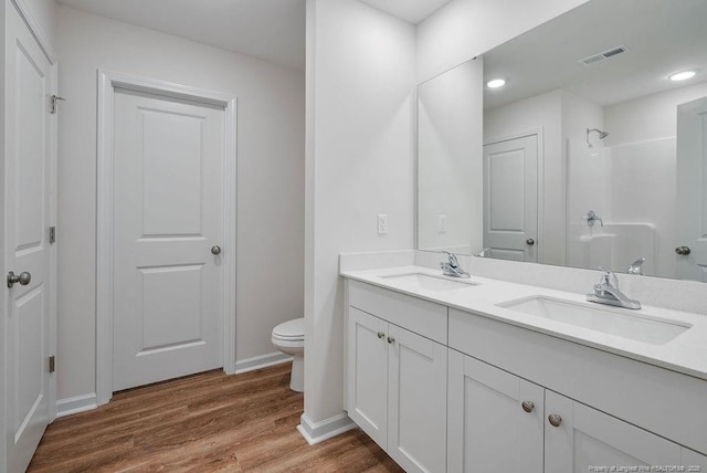 1114 Talmage Rd, Saint Pauls, NC 28384 - bathroom with a shower, toilet, wood finished floors, and baseboards