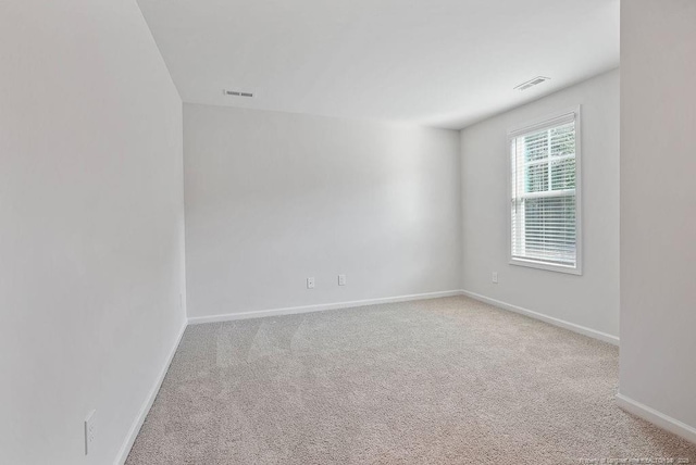 1114 Talmage Rd, Saint Pauls, NC 28384 - carpeted empty room with baseboards