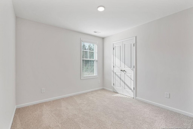 1114 Talmage Rd, Saint Pauls, NC 28384 - unfurnished bedroom with carpet, baseboards, and a closet
