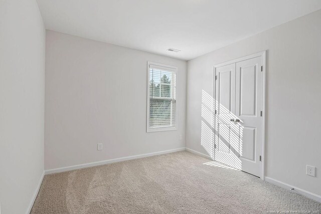 1114 Talmage Rd, Saint Pauls, NC 28384 - unfurnished bedroom featuring carpet floors and baseboards