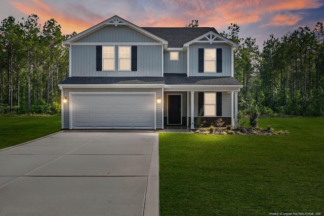 1114 Talmage Rd, Saint Pauls, NC 28384 - view of front of house featuring concrete driveway, a garage, a front yard, covered porch, and a shingled roof