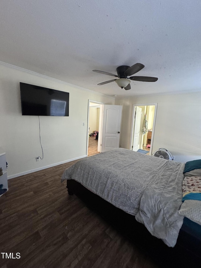 bedroom with ceiling fan and dark hardwood / wood-style flooring