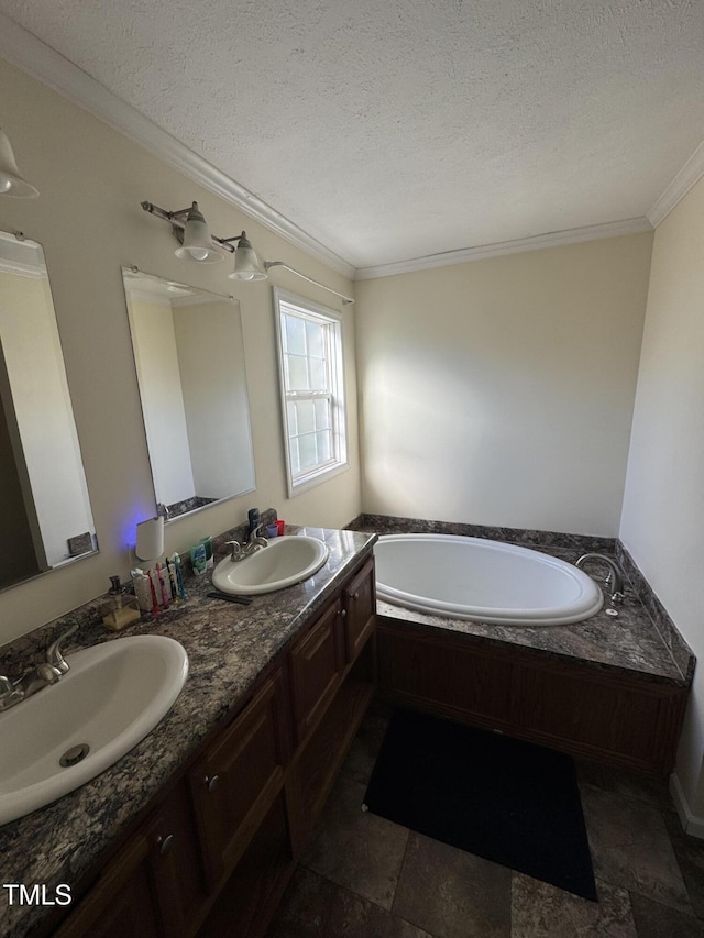 bathroom featuring a textured ceiling, a bathing tub, crown molding, and vanity