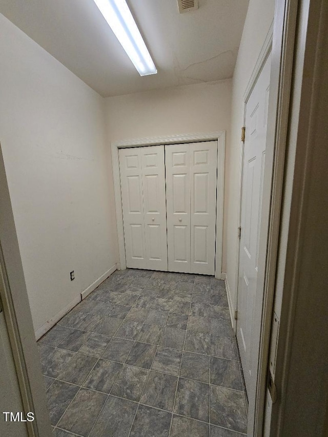 unfurnished bedroom featuring a closet