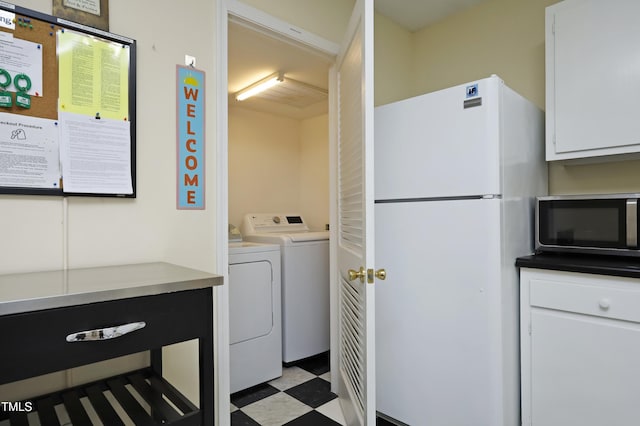 laundry area featuring washing machine and clothes dryer