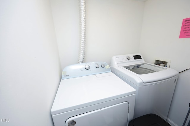 laundry room with washer and dryer