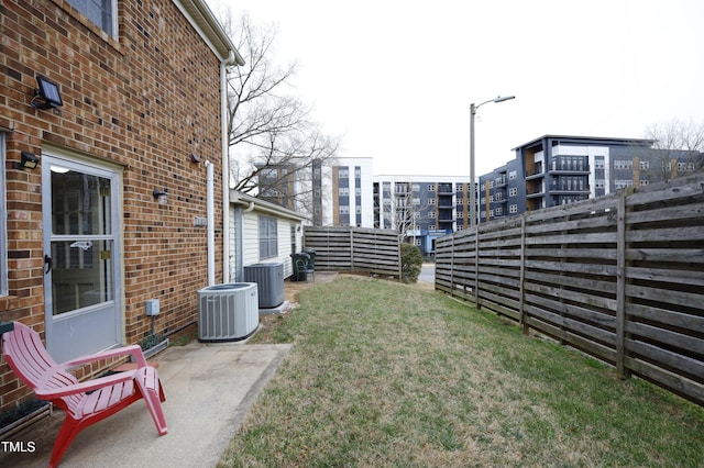 view of yard featuring central air condition unit