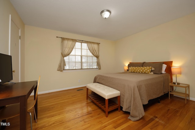 bedroom with light wood-type flooring