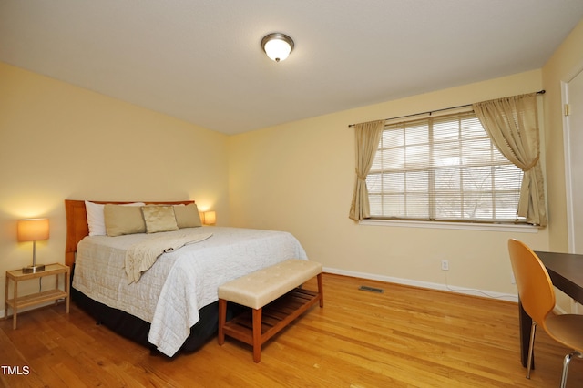 bedroom featuring hardwood / wood-style floors