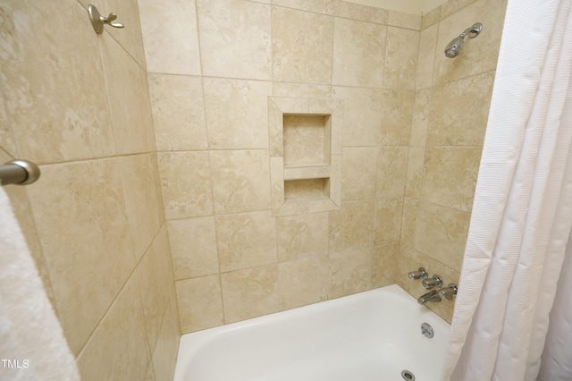 bathroom featuring shower / bathtub combination with curtain