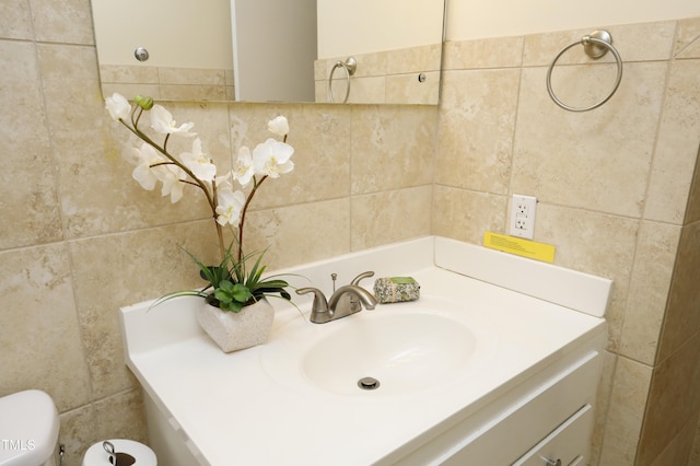 bathroom featuring toilet and vanity