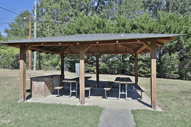 surrounding community featuring a gazebo, a patio area, and a lawn