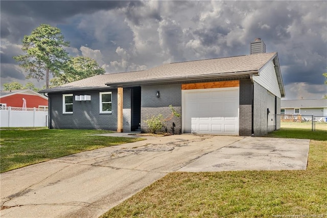 single story home featuring a front lawn and a garage