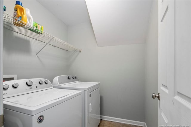 laundry room featuring laundry area, baseboards, and separate washer and dryer