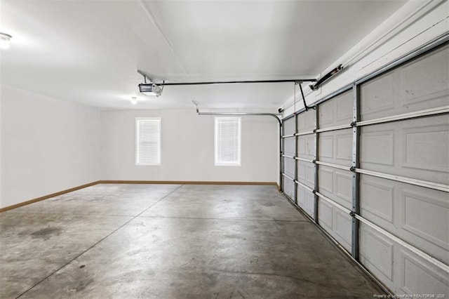 garage featuring baseboards and a garage door opener