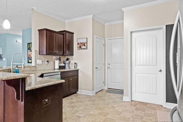 kitchen featuring crown molding, decorative light fixtures, dark brown cabinets, light stone counters, and kitchen peninsula