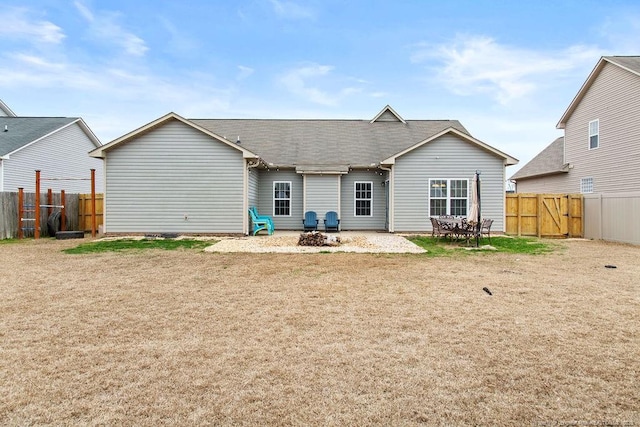 rear view of property featuring a patio area