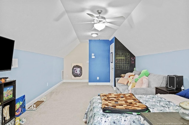 carpeted bedroom featuring ceiling fan and vaulted ceiling