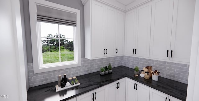 bar with backsplash, dark stone countertops, and white cabinetry