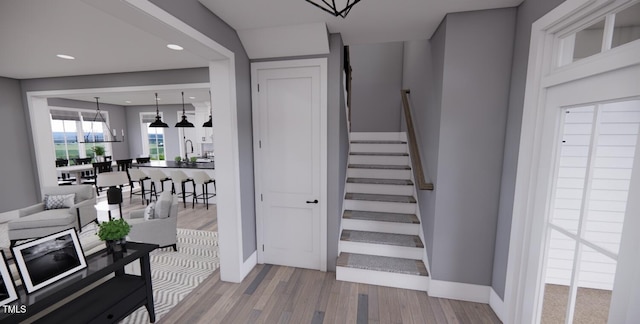 stairway featuring sink and hardwood / wood-style floors