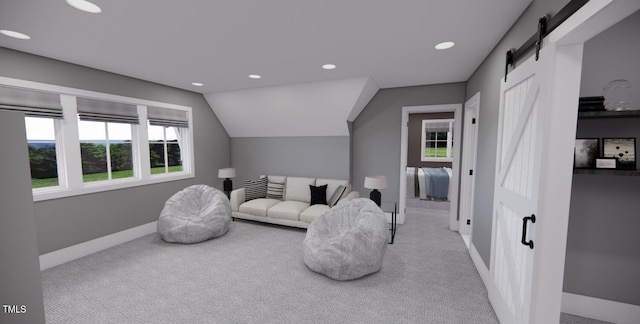 carpeted living room with lofted ceiling and a barn door