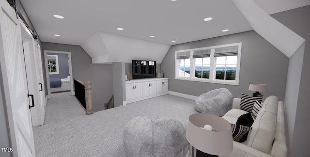 bedroom with light colored carpet, lofted ceiling, and a barn door