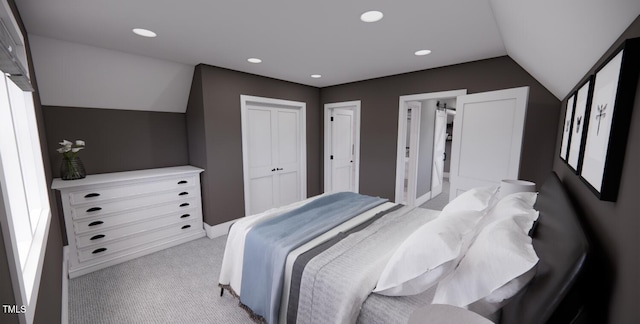 carpeted bedroom with a closet and lofted ceiling