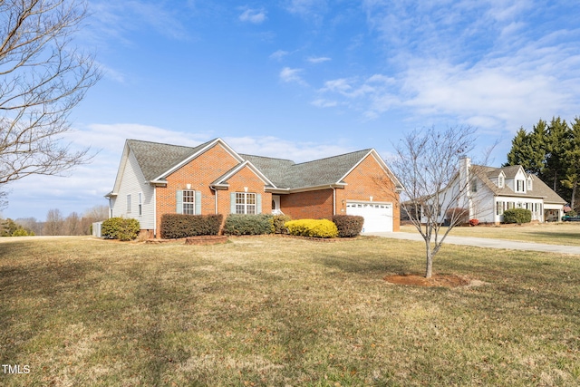 view of front of house featuring a garage and a front lawn