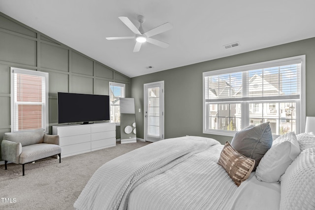 carpeted bedroom with ceiling fan and lofted ceiling