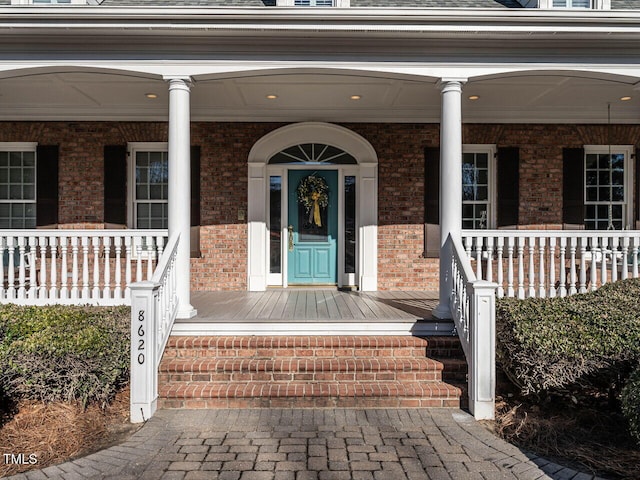 property entrance with covered porch