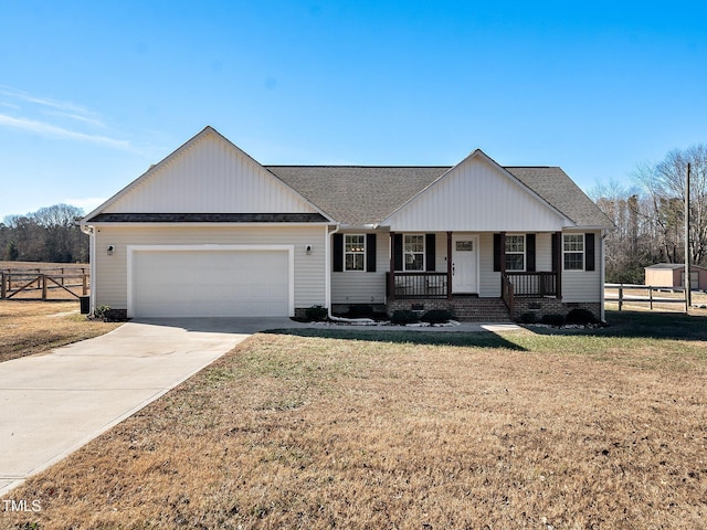 ranch-style house with a front yard, a garage, and a porch