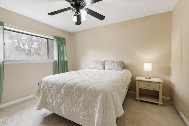 bedroom with ceiling fan and light colored carpet