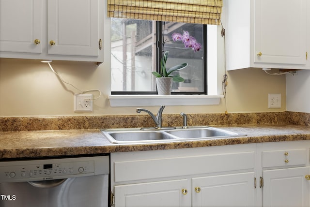 kitchen with sink, white cabinetry, and stainless steel dishwasher