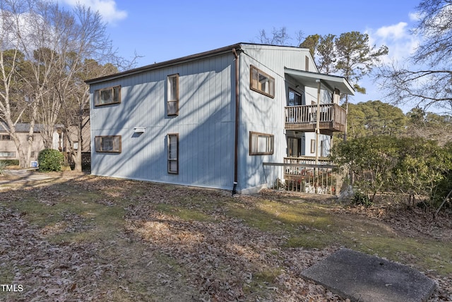 view of home's exterior featuring a balcony