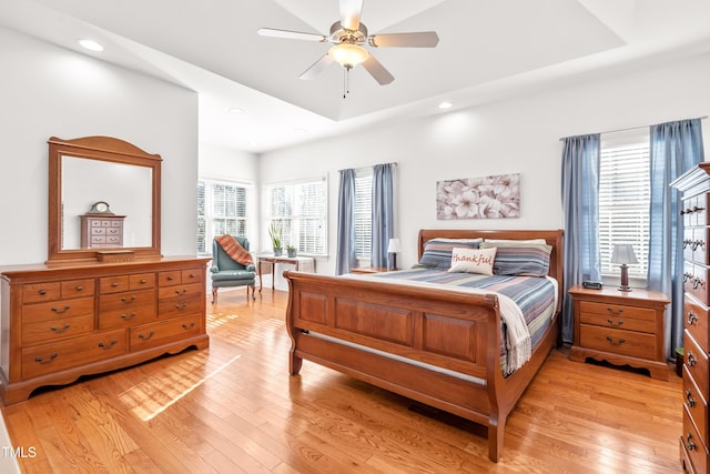 bedroom featuring ceiling fan and light hardwood / wood-style flooring