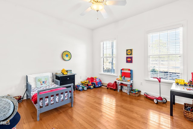 bedroom featuring ceiling fan and wood-type flooring