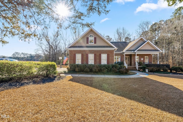 craftsman-style house with a front yard and a porch