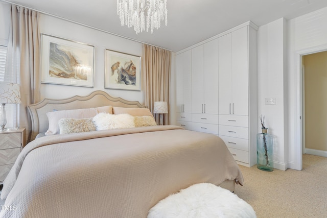 carpeted bedroom with a notable chandelier and a closet