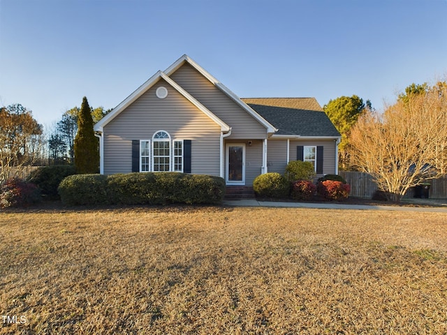 single story home featuring a front yard