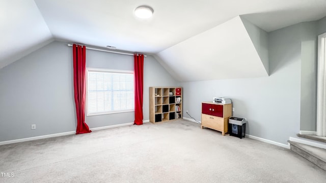 bonus room featuring carpet floors and vaulted ceiling