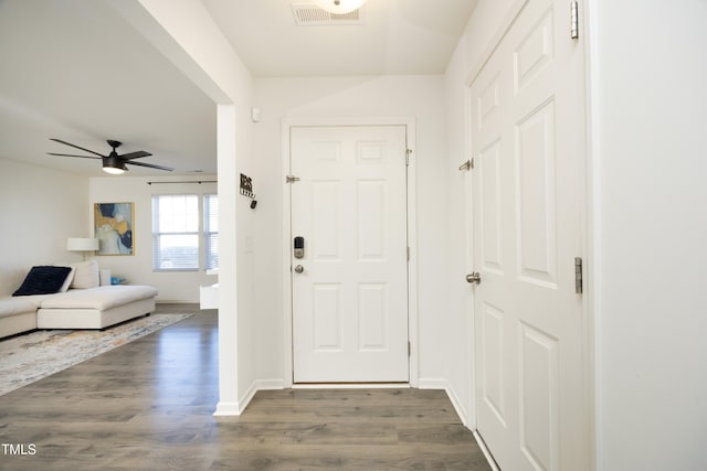 foyer featuring ceiling fan and dark hardwood / wood-style flooring