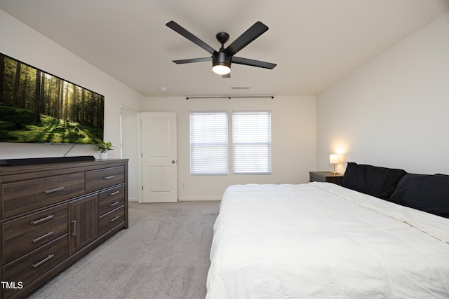 bedroom featuring light colored carpet and ceiling fan