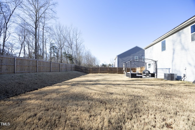 view of yard with an outdoor living space and cooling unit