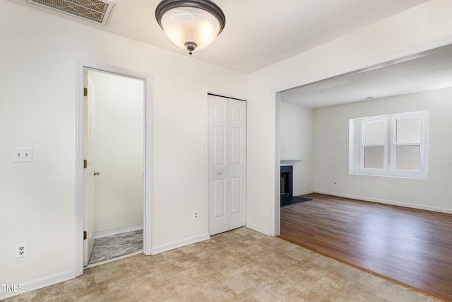 interior space featuring light hardwood / wood-style flooring and a closet